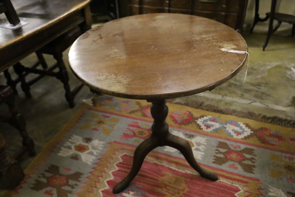 A George III circular mahogany tilt top tripod tea table, 68cm diameter